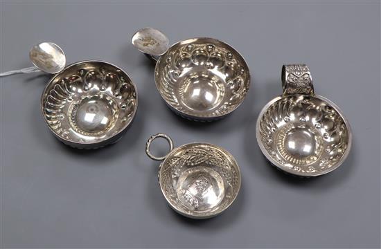 Three 19th century French white metal taste vin and one other small continental taste vin, largest 10.3cm.